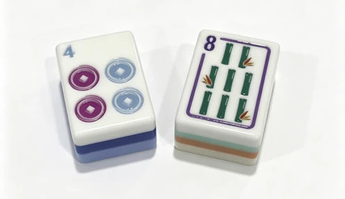 Close-up of colorful acrylic mahjong tiles