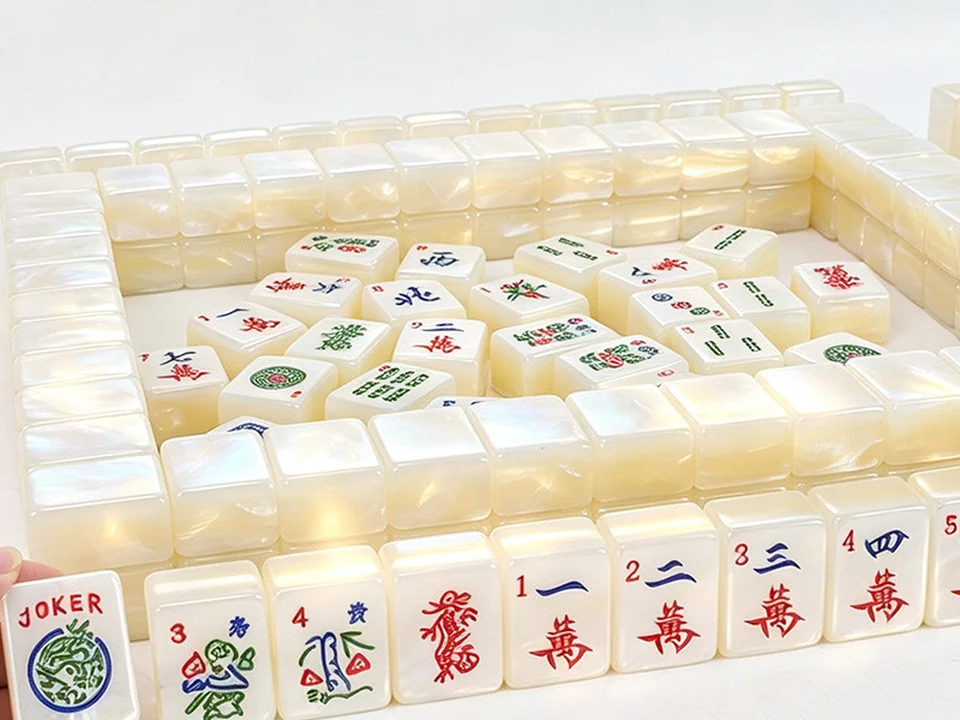 Cream pearl acrylic mahjong tiles with engraved red characters