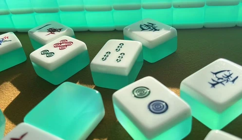 Acrylic Mahjong tile finish comparison showing pearl, tortoise, transparent and solid surfaces